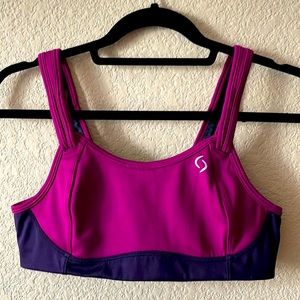 Brooks sports bra in magenta w/ purple trim, size medium.